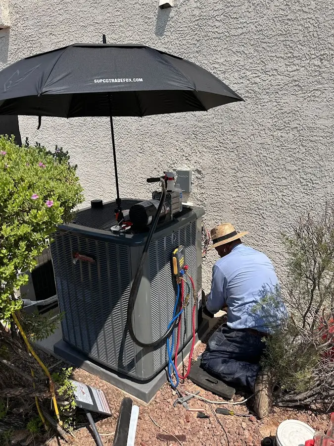HVAC technician performing outdoor AC maintenance in Benicia
